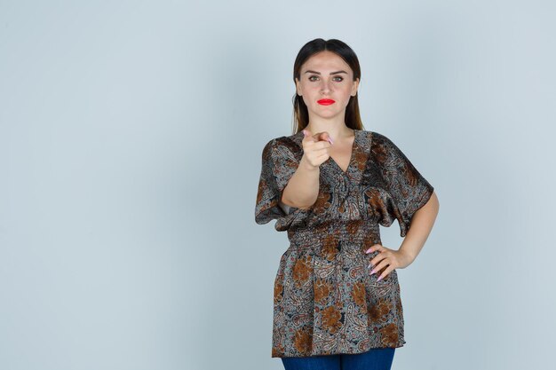 Expressive young lady posing in the studio