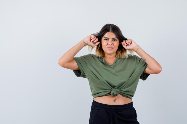 Expressive young lady posing in the studio