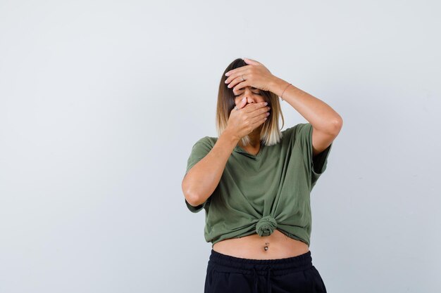 Expressive young lady posing in the studio