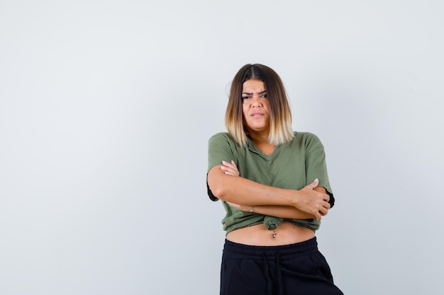 Expressive young lady posing in the studio