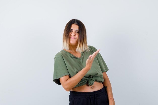 Expressive young lady posing in the studio