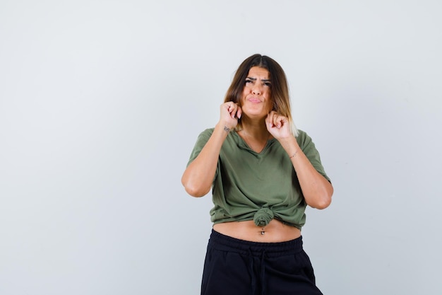 Expressive young lady posing in the studio