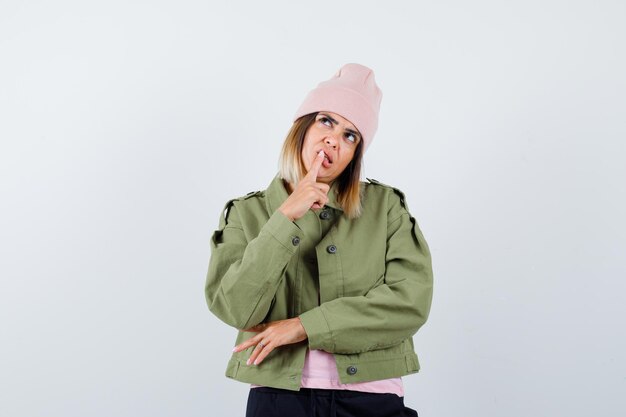 Expressive young lady posing in the studio