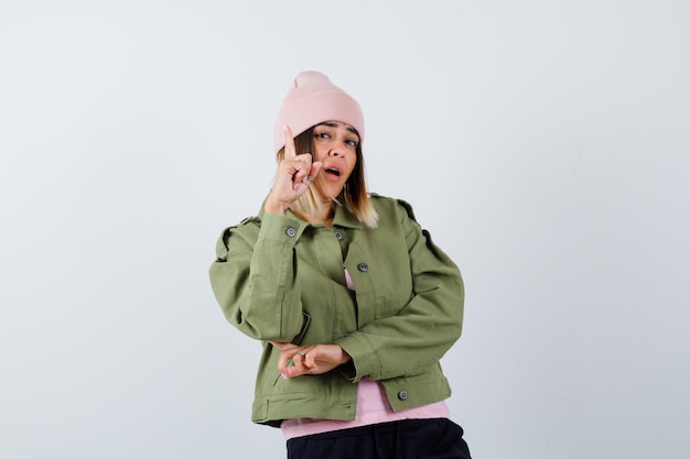 Expressive young lady posing in the studio