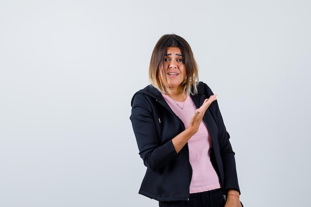 Expressive young lady posing in the studio