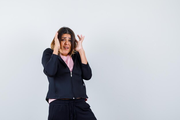 Expressive young lady posing in the studio