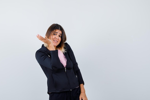 Expressive young lady posing in the studio