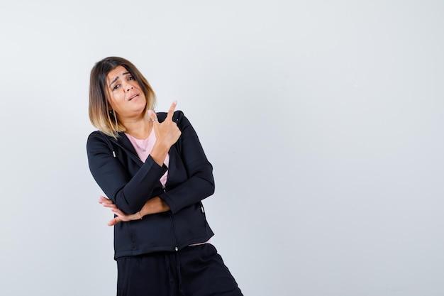 Expressive young lady posing in the studio