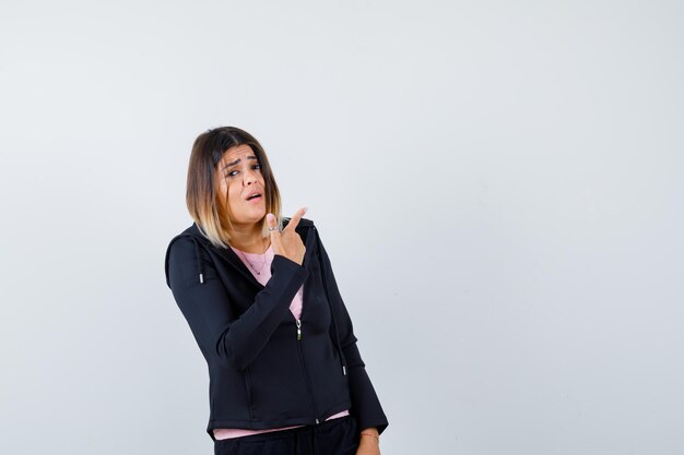 Expressive young lady posing in the studio