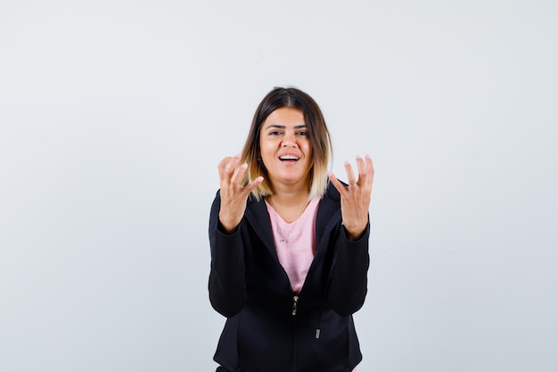 Expressive young lady posing in the studio