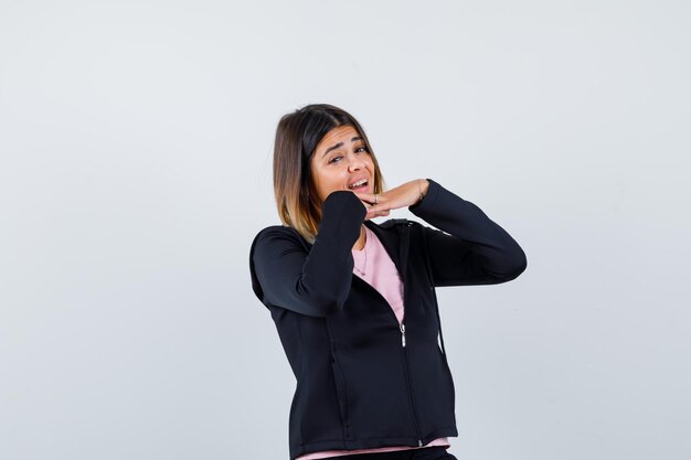 Expressive young lady posing in the studio