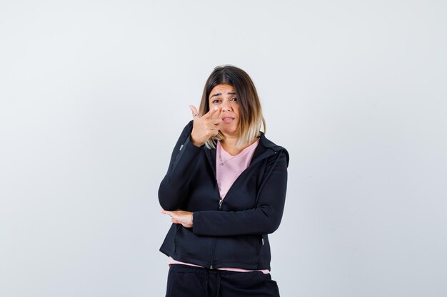 Expressive young lady posing in the studio