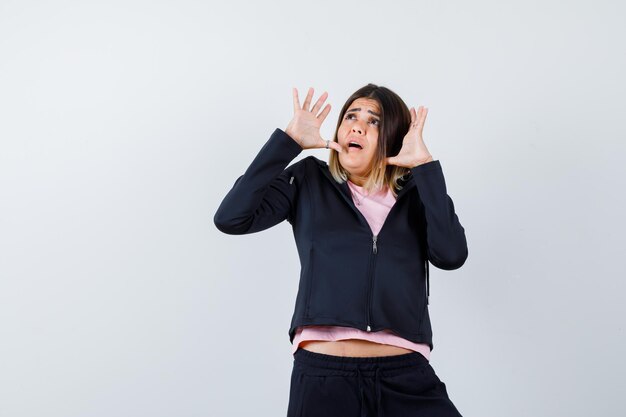 Expressive young lady posing in the studio