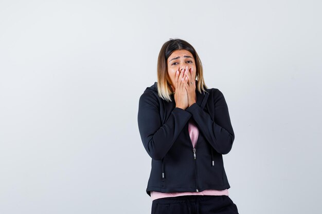 Expressive young lady posing in the studio