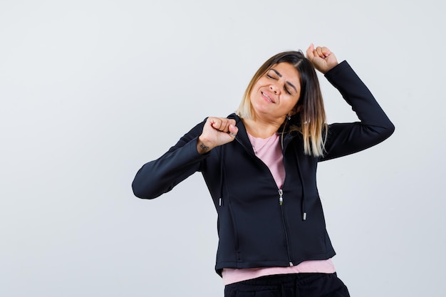 Expressive young lady posing in the studio