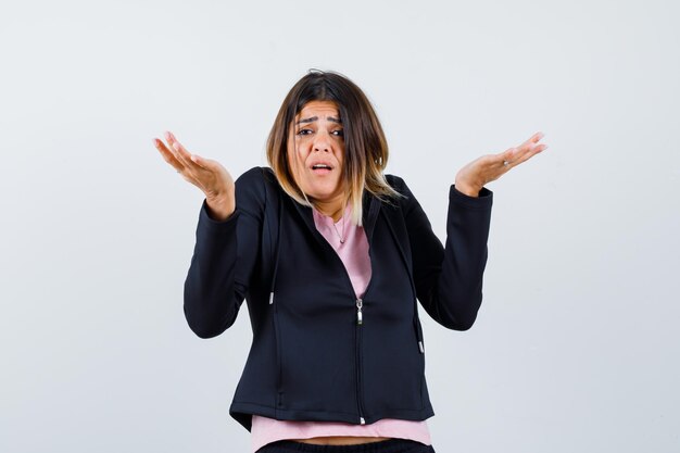 Expressive young lady posing in the studio