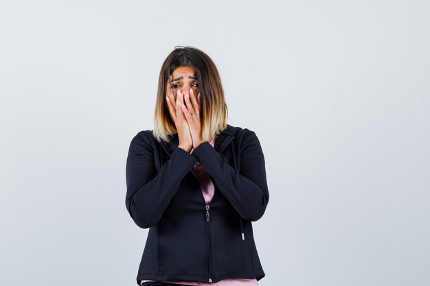 Expressive young lady posing in the studio