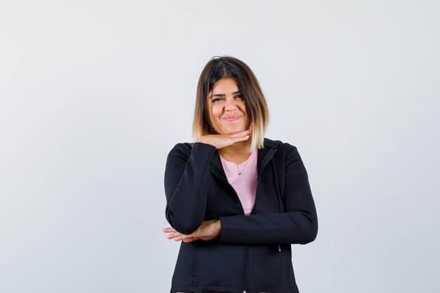 Expressive young lady posing in the studio