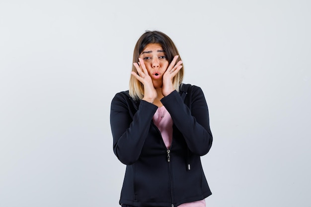 Expressive young lady posing in the studio