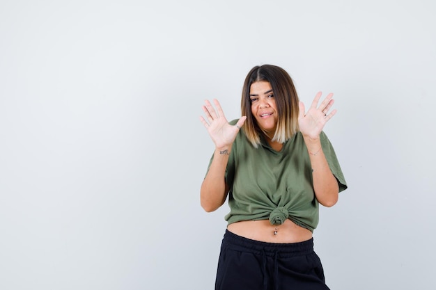 Expressive young lady posing in the studio