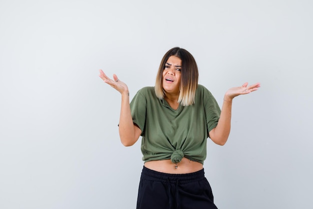 Expressive young lady posing in the studio