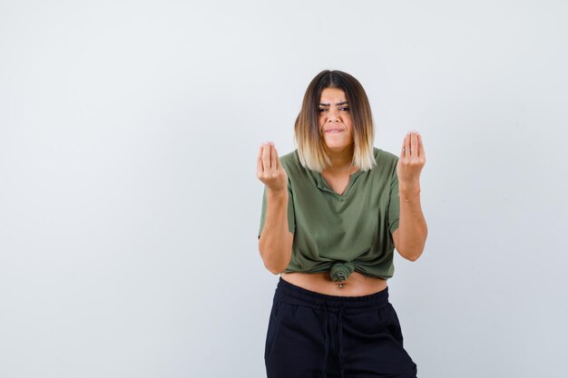 Expressive young lady posing in the studio