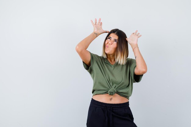 Expressive young lady posing in the studio