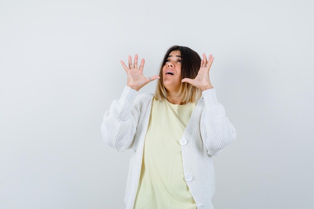 Expressive young lady posing in the studio