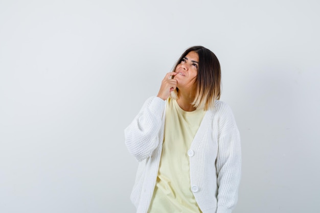 Expressive young lady posing in the studio