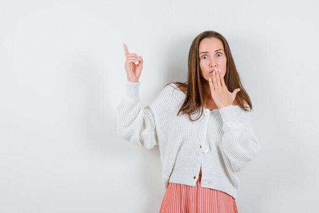 Expressive young lady posing in the studio