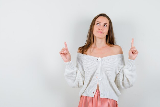 Expressive young lady posing in the studio