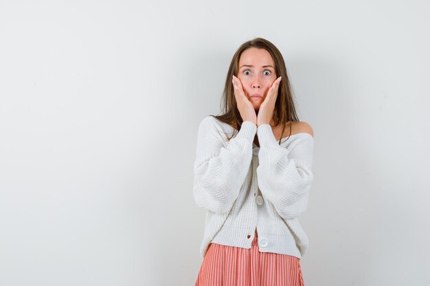 Expressive young lady posing in the studio