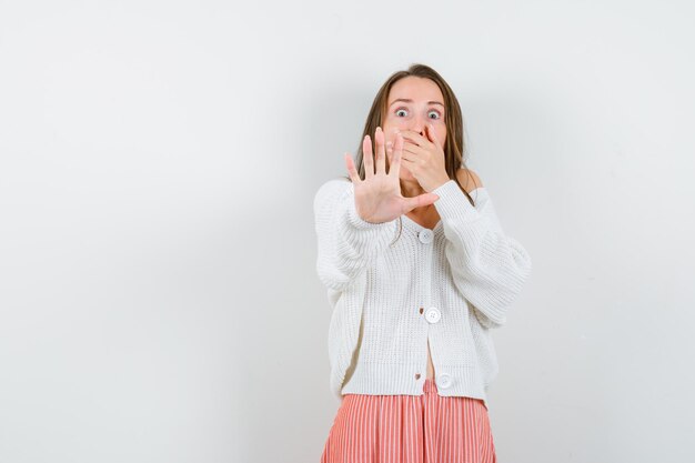 Expressive young lady posing in the studio