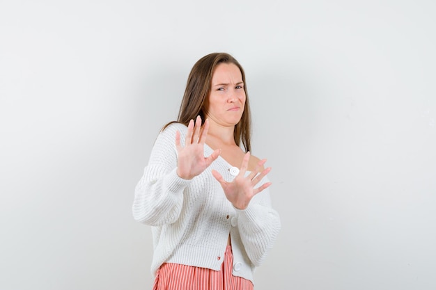 Expressive young lady posing in the studio