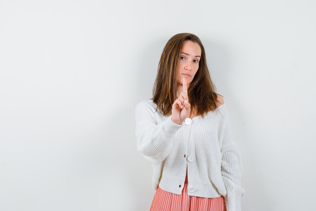 Expressive young lady posing in the studio