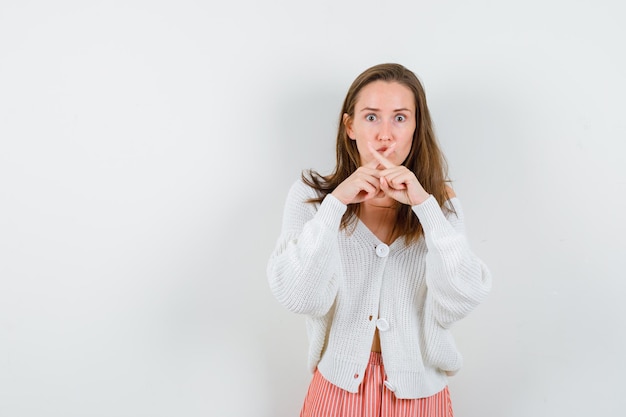 Expressive young lady posing in the studio