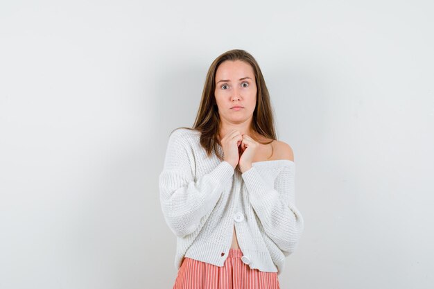 Expressive young lady posing in the studio