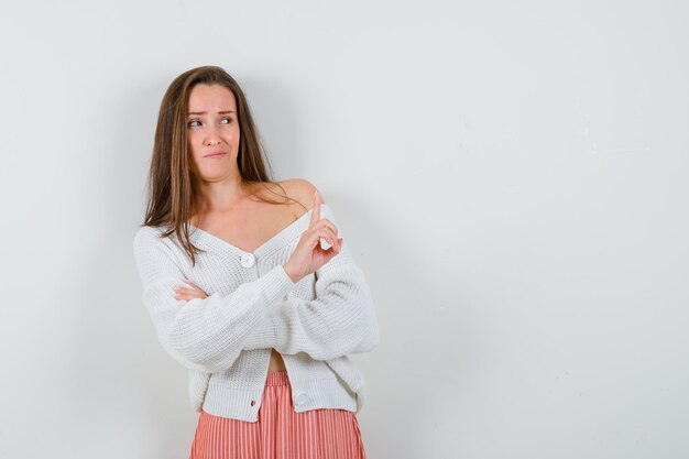 Expressive young lady posing in the studio