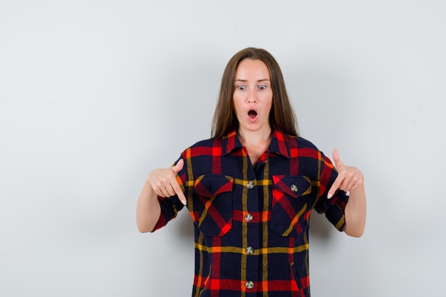 Expressive young lady posing in the studio