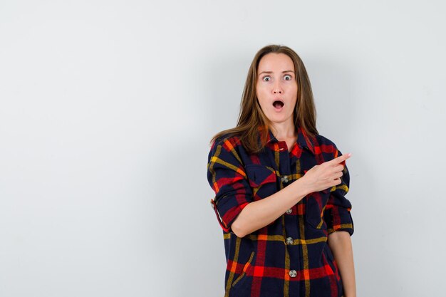 Expressive young lady posing in the studio