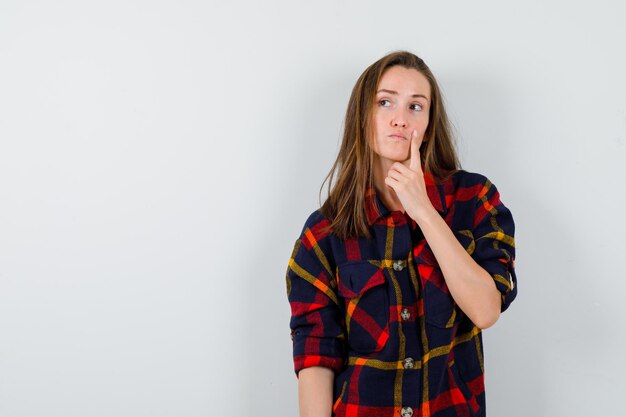 Expressive young lady posing in the studio