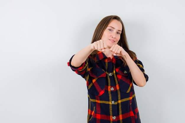 Expressive young lady posing in the studio