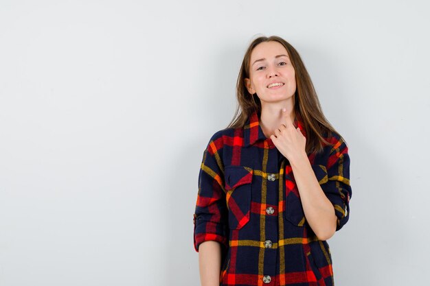 Expressive young lady posing in the studio