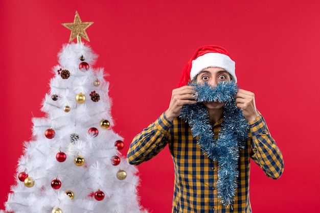 Free photo expressive young man posing for christmas