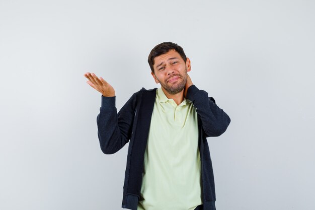 Expressive young man posing in the studio