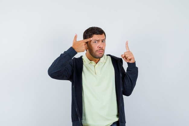 Expressive young man posing in the studio