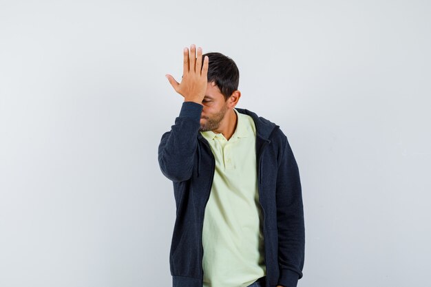 Expressive young man posing in the studio