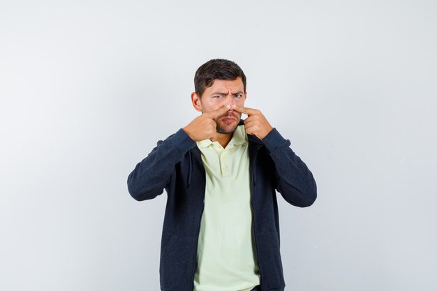 Expressive young man posing in the studio