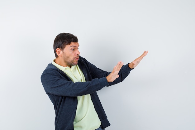 Expressive young man posing in the studio