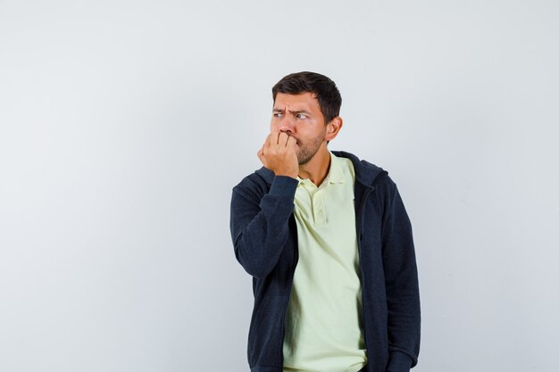 Expressive young man posing in the studio